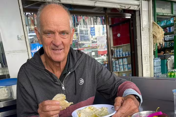 Traveler enjoying local Egyptian meal at a Cairo café during 12-day Egypt tour with Nile cruise, pyramids and Hurghada