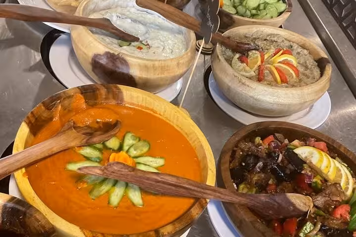 Egyptian buffet on Cairo Nile dinner cruise featuring mezze dips, salads, and traditional appetizers