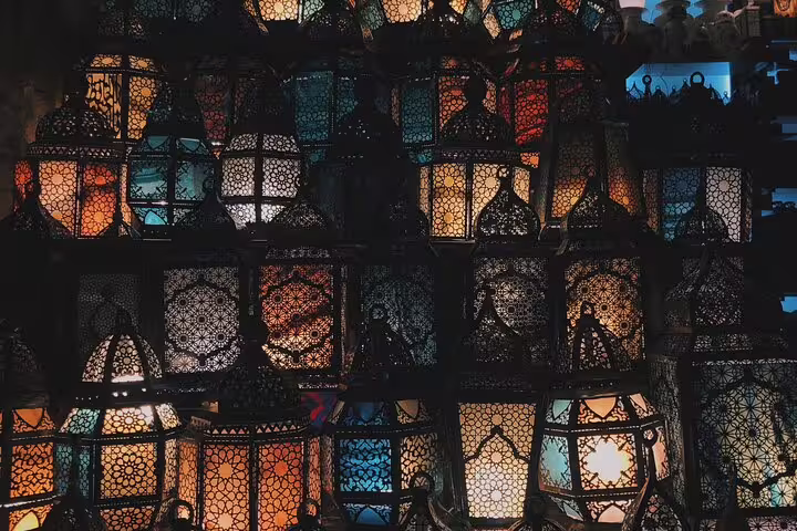 Rows of traditional Egyptian metal lanterns glowing at El Khan El Khalili Bazaar on a Cairo private tour