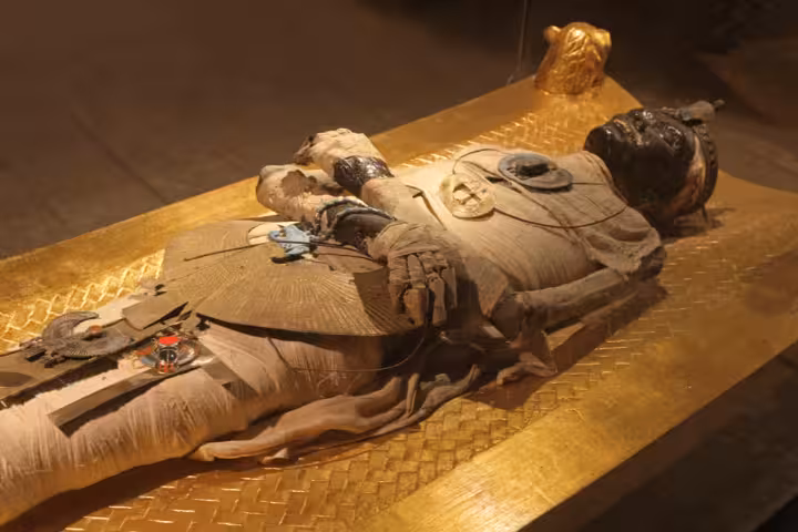 Ancient Egyptian mummy exhibit in Cairo museum, a highlight of the 8-day Nile cruise from Cairo to Abu Simbel