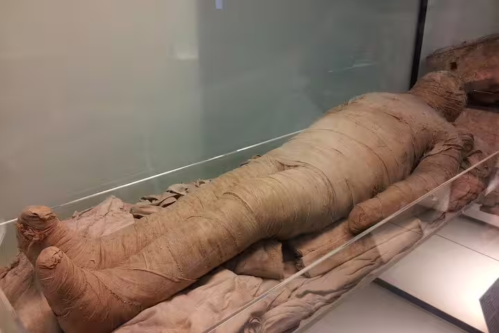Ancient Egyptian mummy in Cairo museum exhibit, culture highlight on 4-day Cairo and Red Sea package