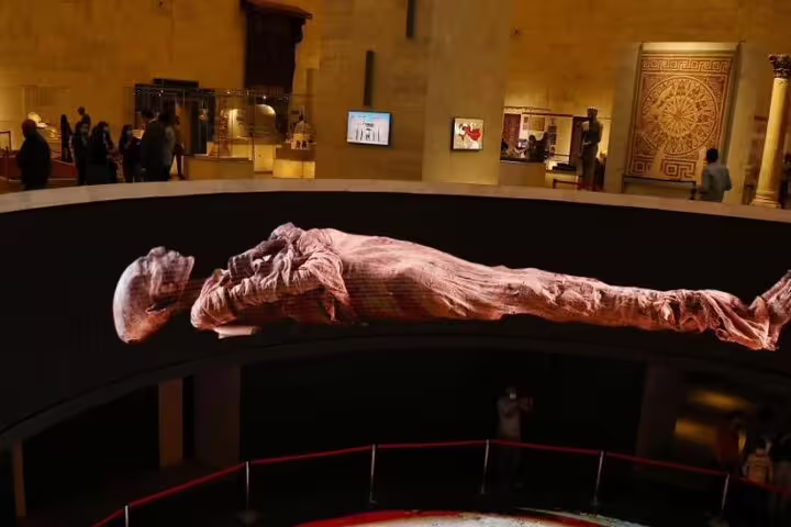 Ancient Egyptian mummy displayed in a museum gallery during a private guided Egyptian Museum tour in Cairo