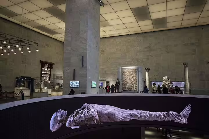 Royal mummy display inside the National Museum of Egyptian Civilization in Cairo on guided museum tour