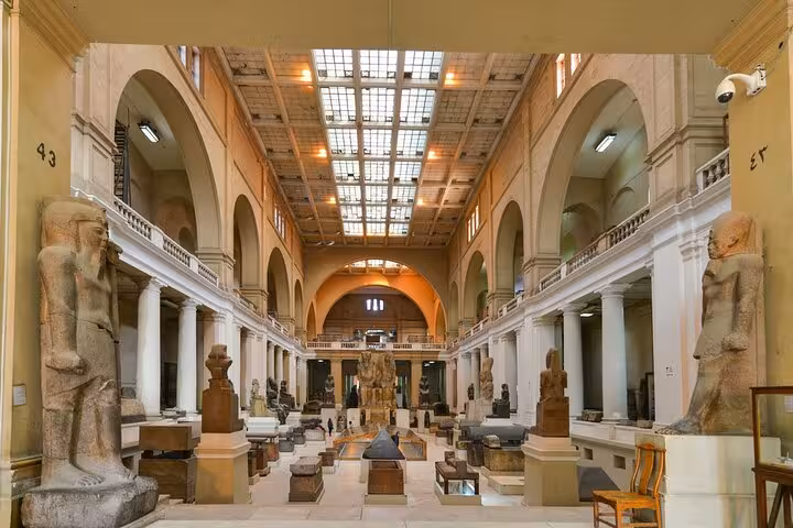 Egyptian Museum Cairo grand gallery with ancient statues and artifacts, highlight of 7-day Egypt tour
