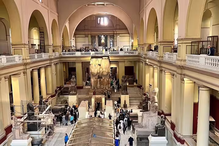 Interior of the Egyptian Museum Cairo with colossal statues, visit on Pyramids of Giza day tour by plane from Sharm