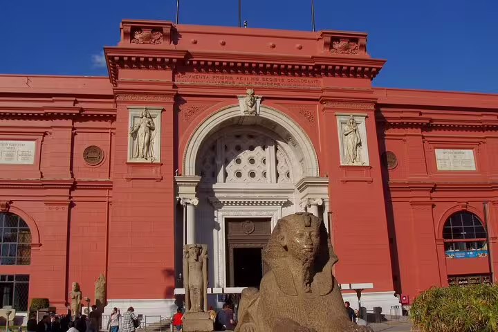 Egyptian Museum Cairo entrance on private Port Said shore excursion, exploring Pharaonic artifacts and statues