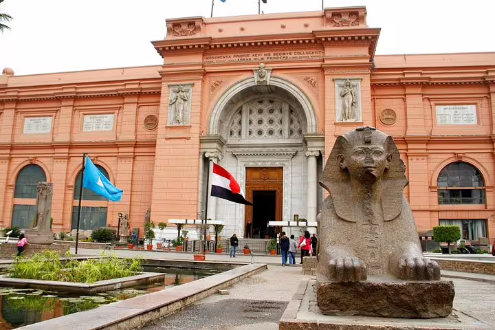 Egyptian Museum Cairo entrance with sphinx and flags, ideal stop on a 4-hour private tour with guide