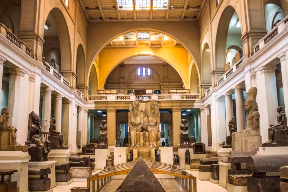 Egyptian Museum Cairo grand hall with colossal statues, ideal stop on private Cairo city tour itinerary