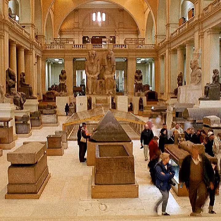 Grand hall inside the Egyptian Museum Cairo with statues and sarcophagi on a private guided tour