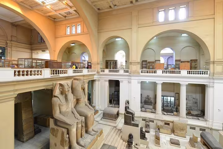 Egyptian Museum Cairo grand hall with pharaoh statues, visited on private Cairo tour from Marsa Alam by flight
