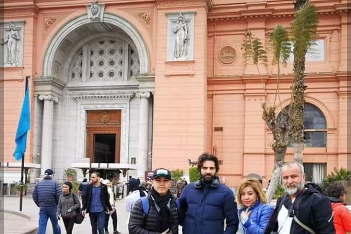 Travelers outside the Egyptian Museum Cairo entrance, meeting guide for a 4-hour private day tour