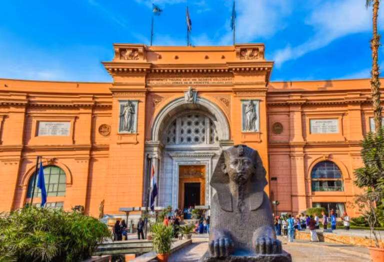 Egyptian Museum Cairo entrance with sphinx statue, key highlight on 3-day Cairo Alexandria and Fayoum tour