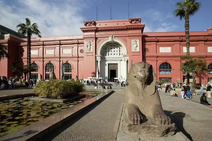 Egyptian Museum Cairo exterior with sphinx statue, must-see stop on 9-day Cairo and Nile cruise itinerary