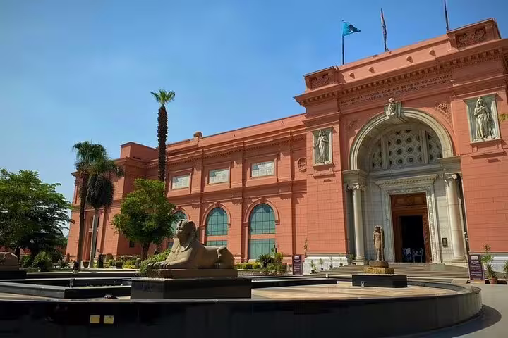 Egyptian Museum Cairo exterior with sphinx statue, stop on Pyramids of Giza and Christian Cairo tour