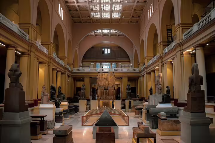 Egyptian Museum grand hall with statues and artifacts, visited on Sharm El Sheikh to Cairo by air guided tour