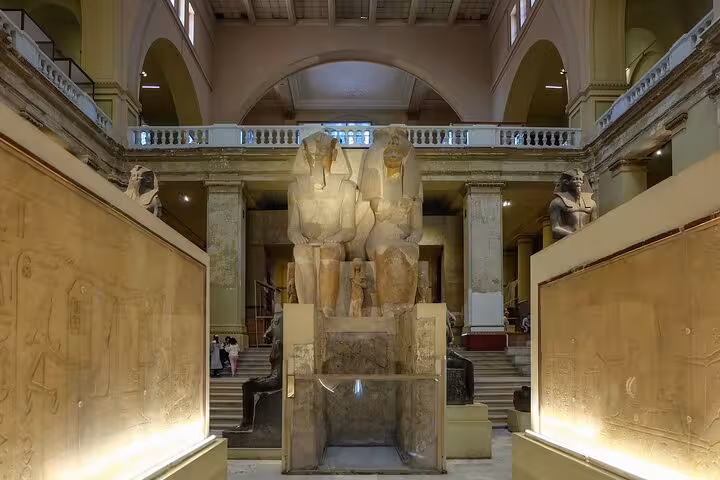 Grand Egyptian Museum gallery with colossal pharaoh statues, key stop on private Cairo tour from Giza Pyramids