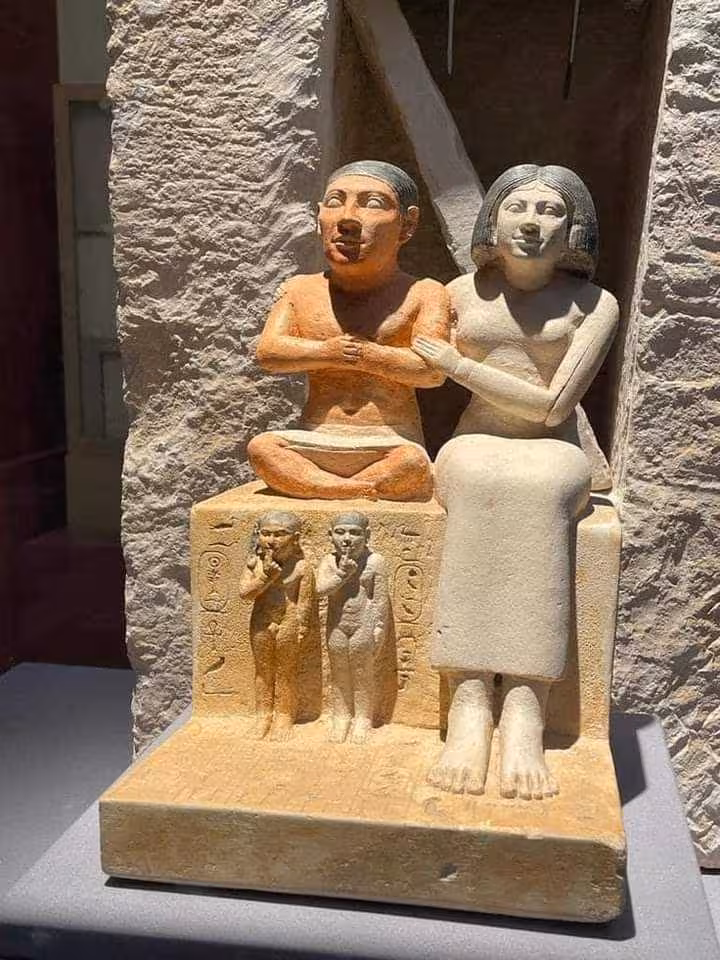 Ancient Egyptian seated couple statue at the Egyptian Museum Cairo on a private guided tour