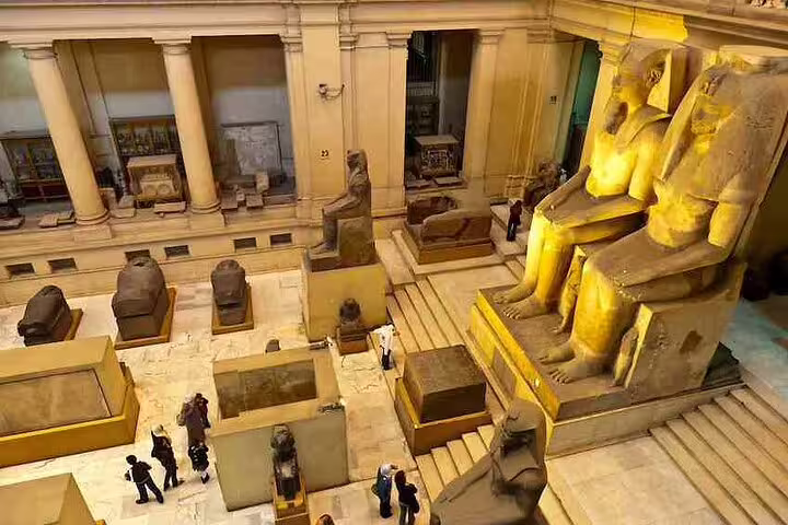 Egyptian Museum interior with colossal statues and ancient artifacts on Sharm El Sheikh to Cairo and Giza day tour