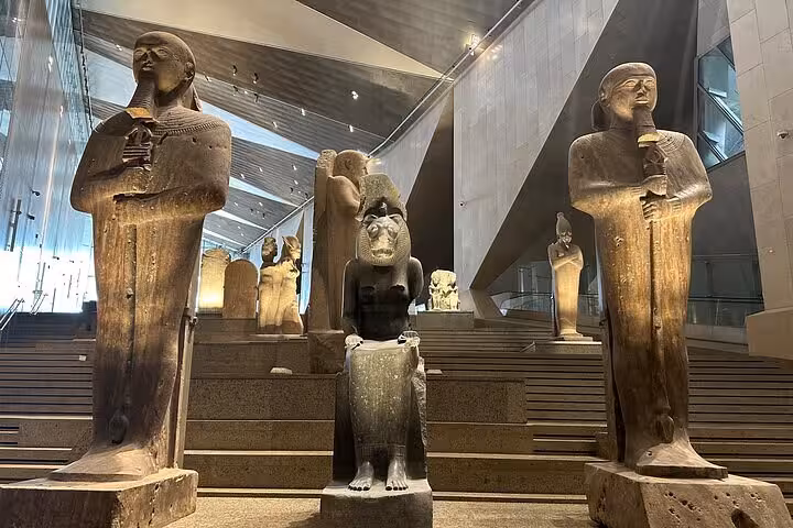 Grand Egyptian Museum statues hall visit on VIP Giza & GEM tour, ancient pharaohs and sphinx sculpture