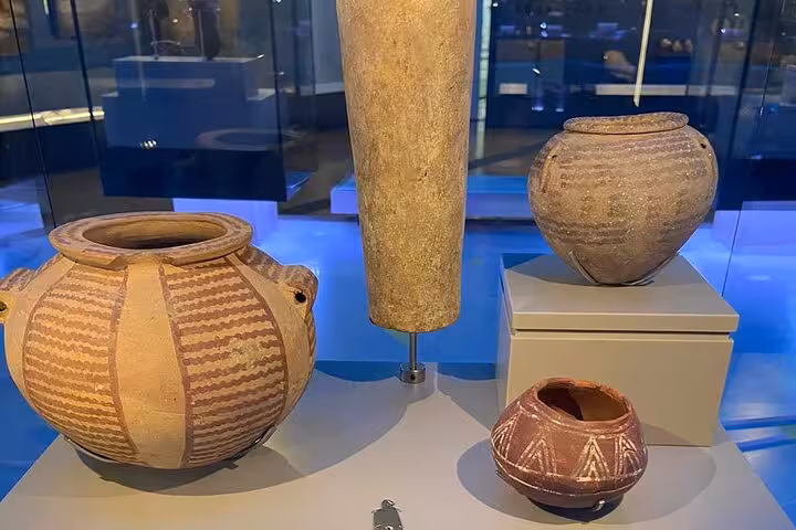Ancient Egyptian pottery jars on display at the Grand Egyptian Museum, part of a Giza Pyramids and lunch tour