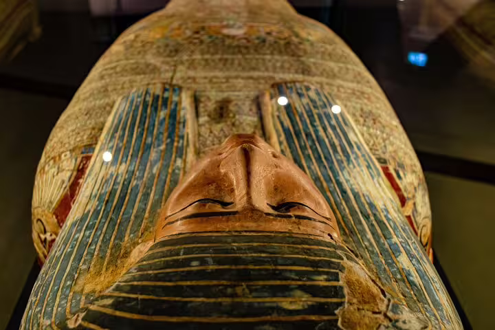 Close-up of painted Egyptian sarcophagus at the Museum of Egyptian Antiquities, a highlight of the private Cairo tour