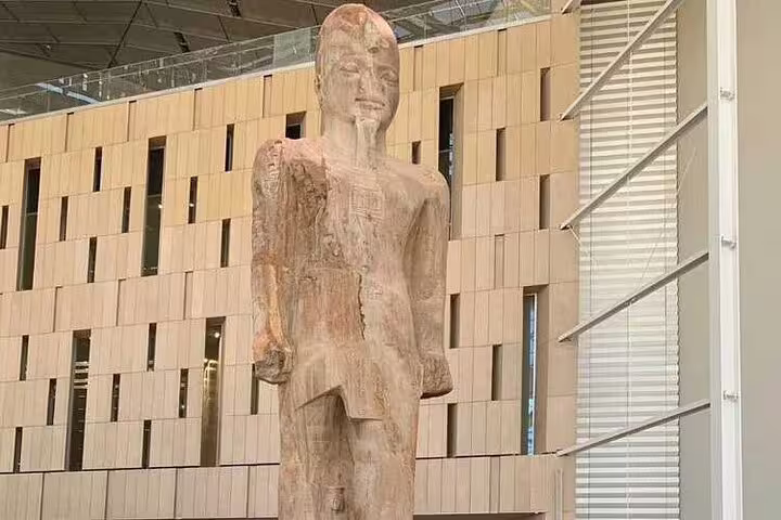 Ancient Egyptian statue inside the Grand Egyptian Museum in Giza, featured on El Sokhna Port Cairo day tour