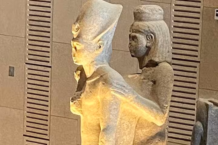 Ancient Egyptian stone statues inside the Grand Egyptian Museum, Cairo, on Giza Pyramids day tour