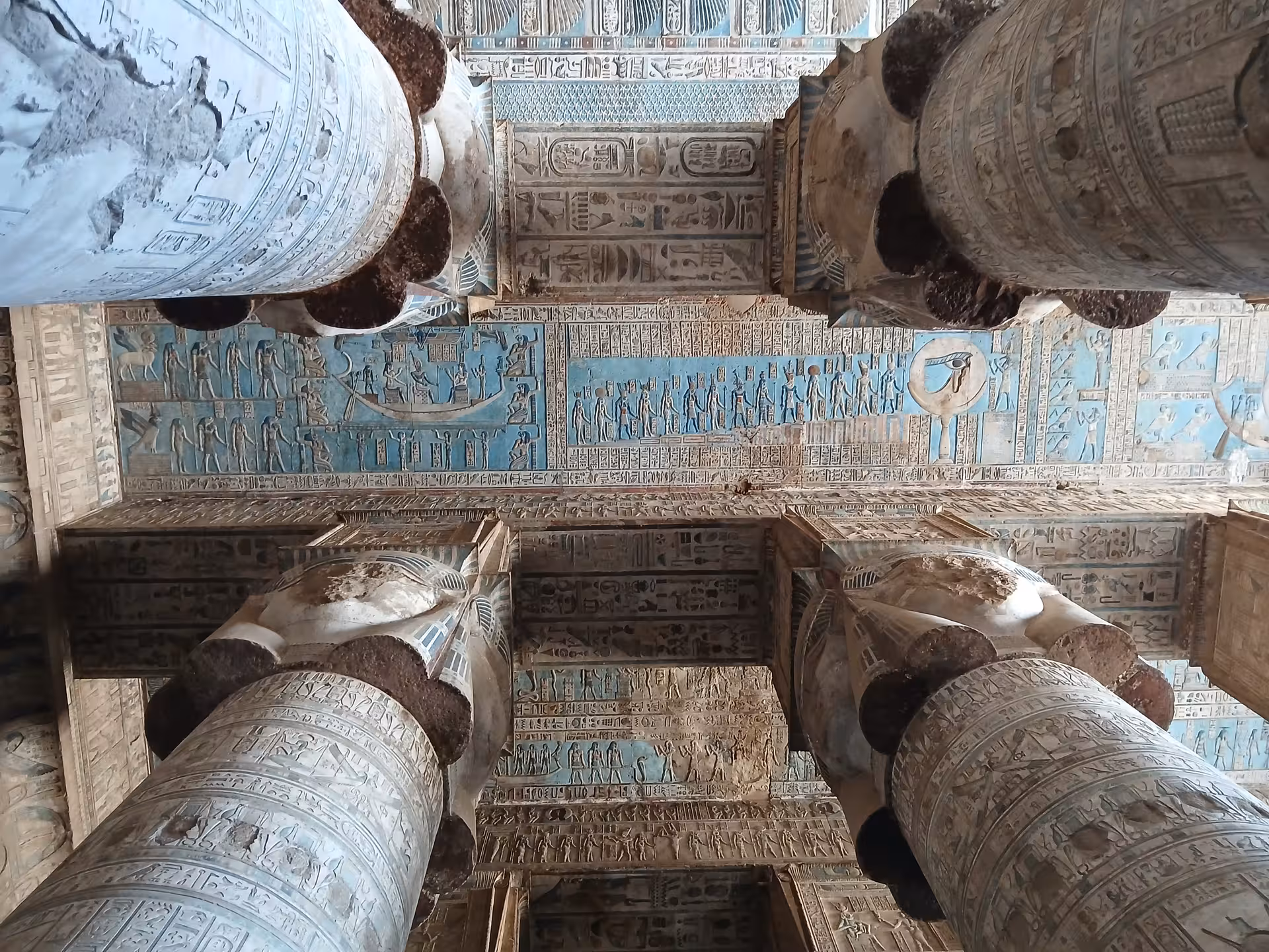 Intricate hieroglyphics and art on the ceiling of an ancient Egyptian temple, highlighting cultural heritage in Dendera.