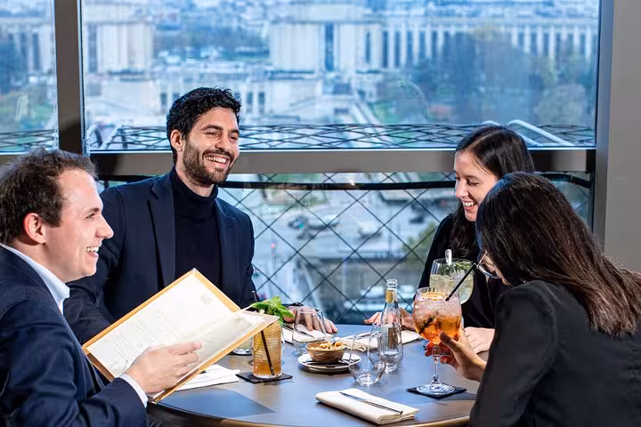 Luxury Eiffel Tower restaurant lunch with friends, included in private Paris tour with Seine cruise and Louvre