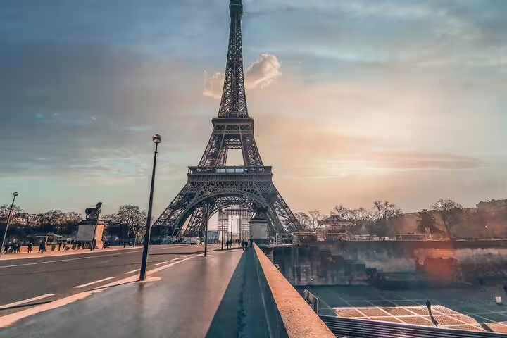 Eiffel Tower viewed from bridge at sunset in Paris, France