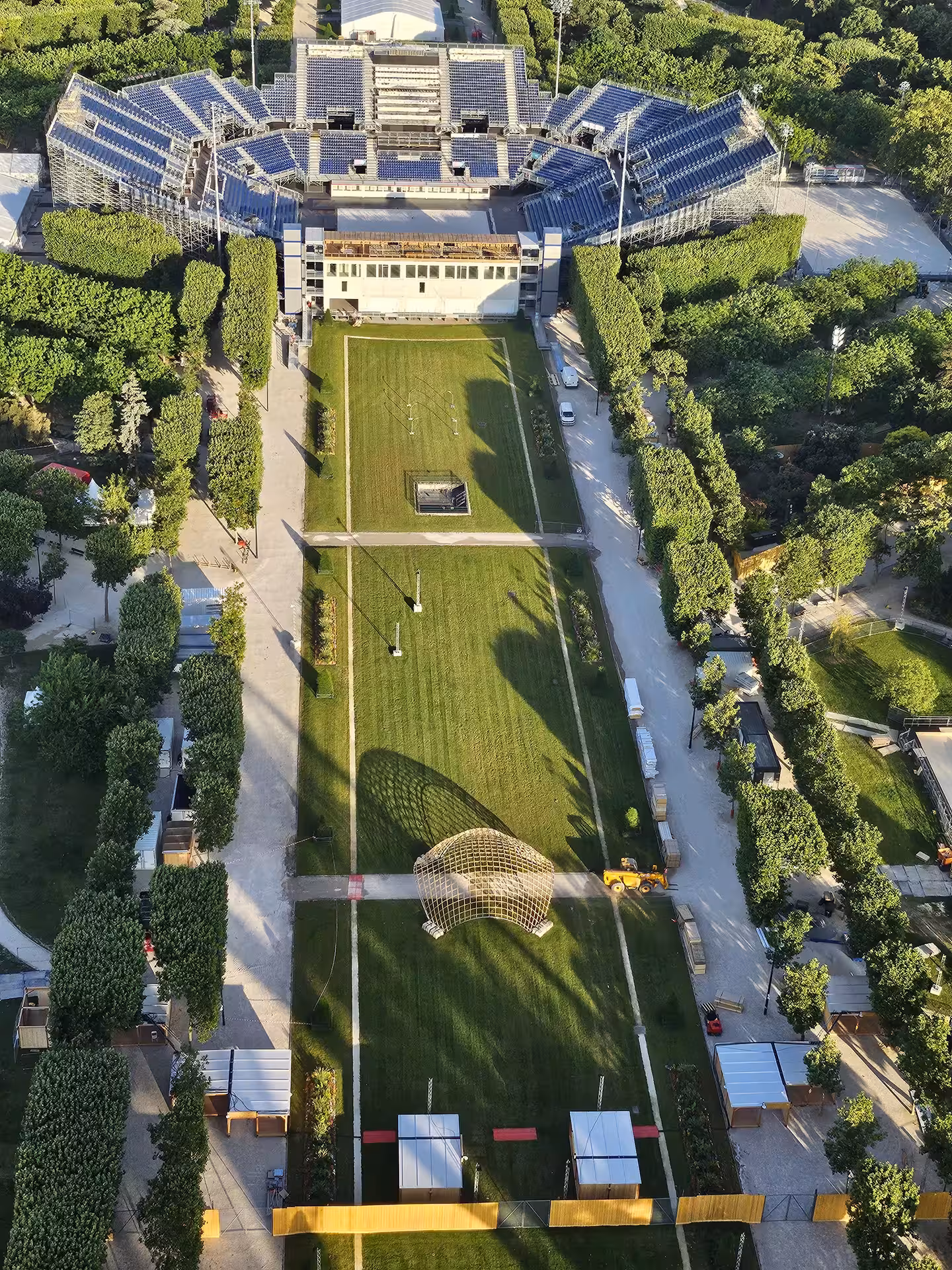 Aerial view from Eiffel Tower second floor overlooking Roland Garros tennis complex and gardens in Paris