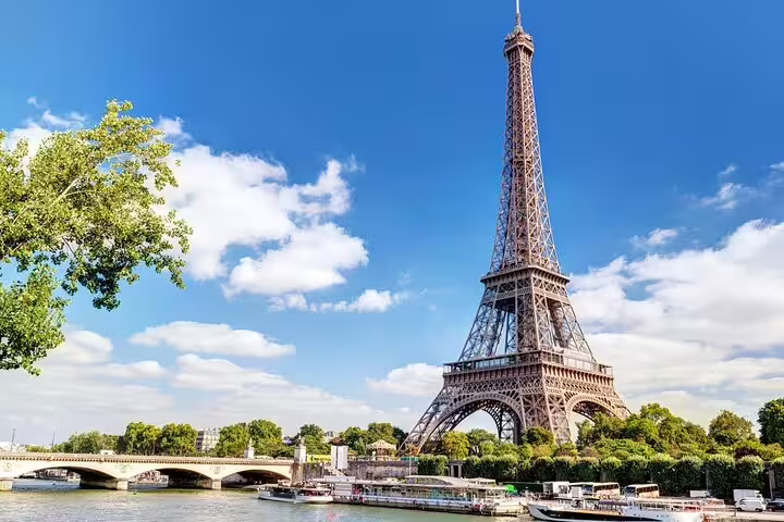 Eiffel Tower viewed from the Seine River on a sunny day in Paris, France
