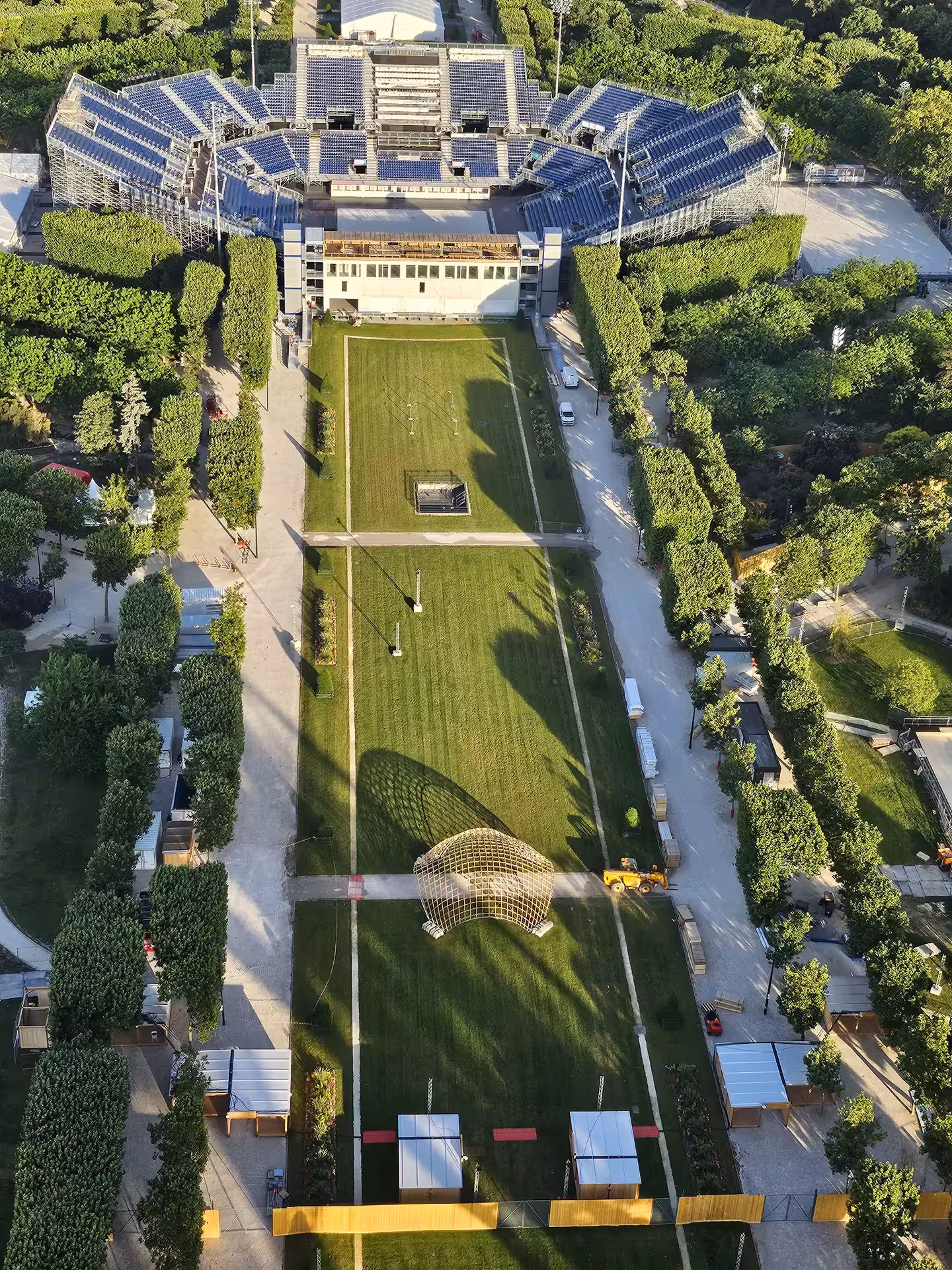 Aerial view of Roland Garros tennis complex and lush green gardens seen from Eiffel Tower summit