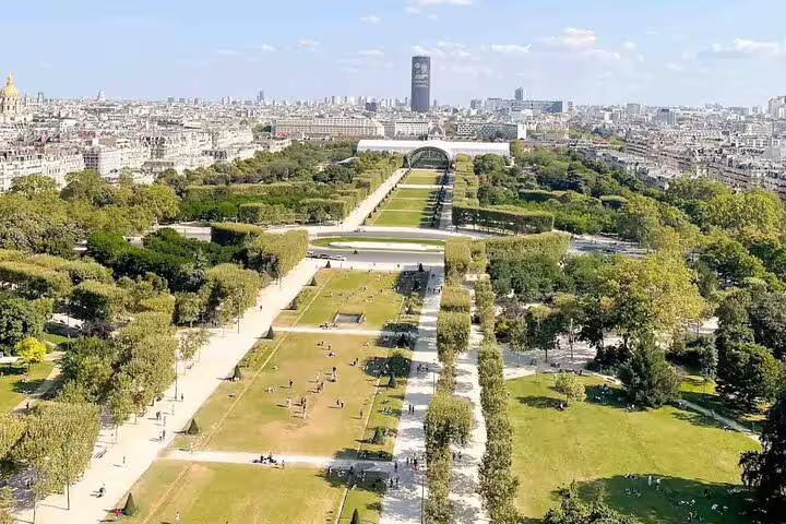 Aerial view of Champ de Mars park and Paris cityscape seen from the Eiffel Tower summit