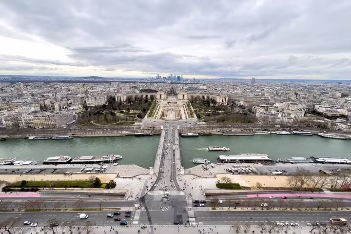 Aerial view from Eiffel Tower top floor showing Seine River, Trocadéro palace and Paris skyline