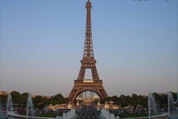 Eiffel Tower viewed from Trocadero fountains at sunset in Paris