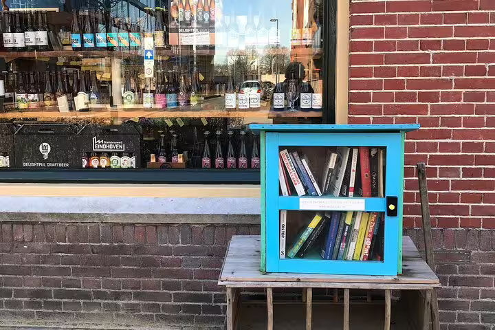 Blue mini library outside an Eindhoven craft beer shop, a quirky stop on the Journey to the Future tour