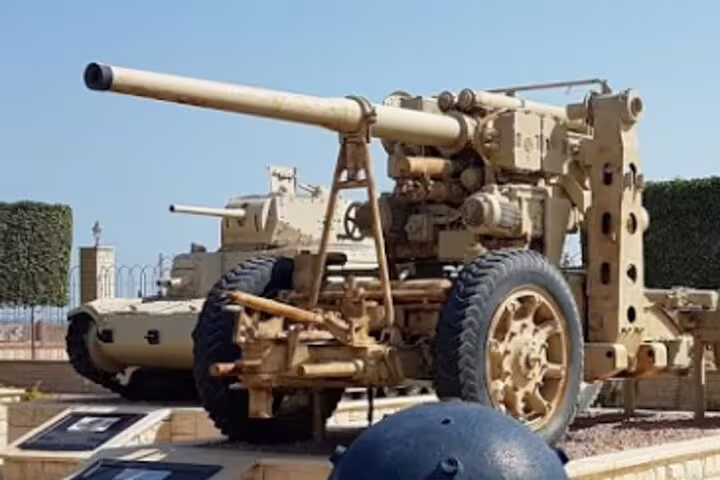 WWII field gun display at El Alamein Military Museum on a day tour from Cairo, Egypt