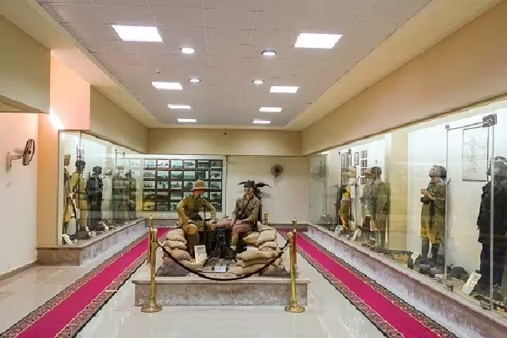 El Alamein War Museum interior with WWII uniforms and trench exhibit, featured on Cairo day trip