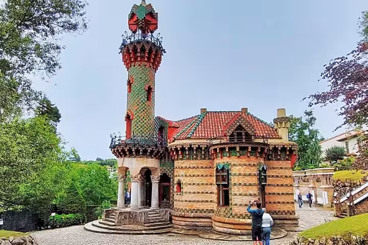 Vibrant El Capricho de Gaudí in Comillas, a highlight of the Santander Modernism tour, surrounded by lush greenery.