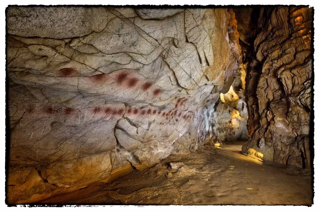 Discover El Castillo Caves' prehistoric red dot paintings, highlighting Spain's ancient rock art heritage.