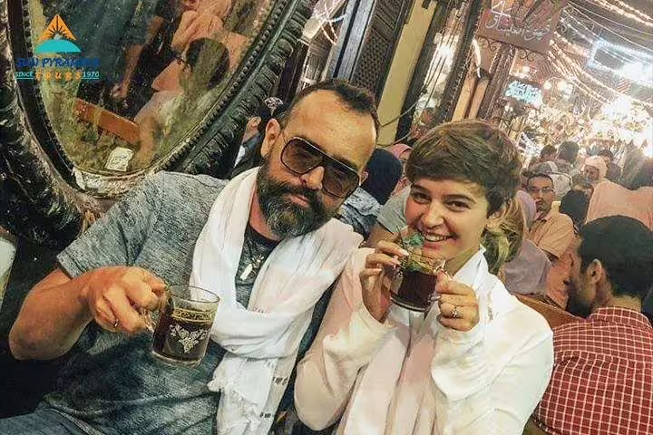 Travelers sipping tea at El-Fishawy Café in Khan el-Khalili bazaar, highlight of El-Moez Street Cairo tour