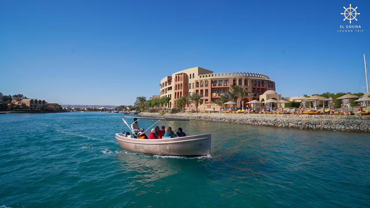 Boat cruise on El Gouna lagoon past waterfront resorts, part of El Gouna city tour and lagoon trip Egypt