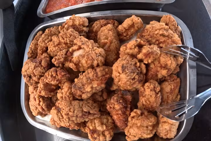 Boat lunch tray with crispy fried chicken served on El Gouna Lagoon dolphin snorkeling and diving excursion