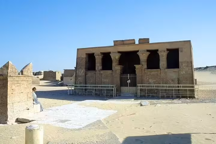 Ancient Egyptian temple facade in El Minya desert, a highlight of a private day tour from Cairo by car