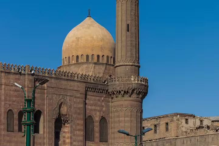 Historic mosque dome and minaret along El-Moez Street in Islamic Cairo, a highlight of the Cairo tour