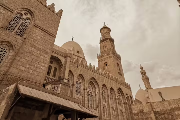Historic mosque facade on El-Moez Street in Islamic Cairo, a highlight of the El-Fishawy Café tour