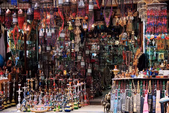 Colorful bazaar shop in El Quseir displaying hookah pipes, lanterns, beaded necklaces, and traditional souvenirs