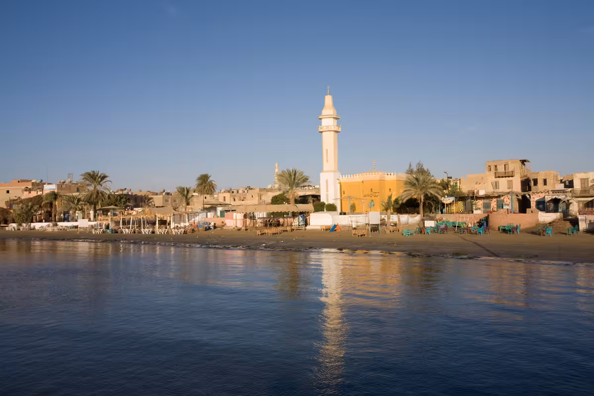 El Quseir waterfront with white mosque minaret and sandy beach along the Red Sea coast