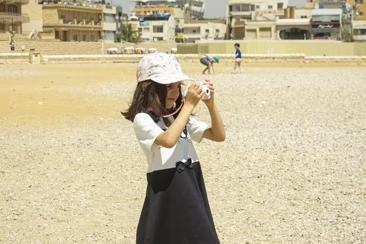 Tourist taking photos at El Sokhna Port before Cairo day trip to Giza Pyramids and Nile lunch cruise